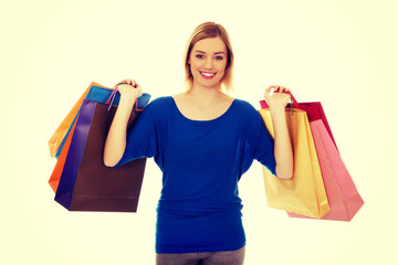 Woman with a lot of shopping bags.