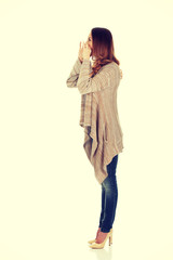 Woman whispers a gossip.