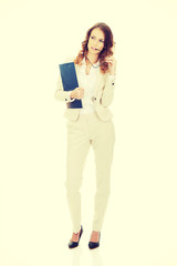 Fototapeta premium Thoughtful businesswoman with clipboard.