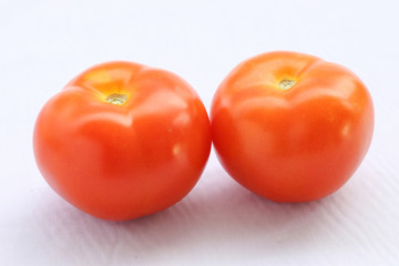 Two fresh ripe red tomato