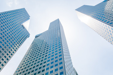 Obraz na płótnie Canvas Skyscraper building at singapore - bright light processing style