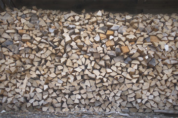 pile of cut wood ready for fire in winter