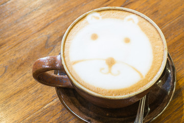 Hot Cappuccino on wooden background ,Cup of art coffee