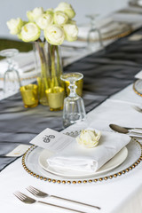 Elegance table set up with lotus flowers, selective focus.