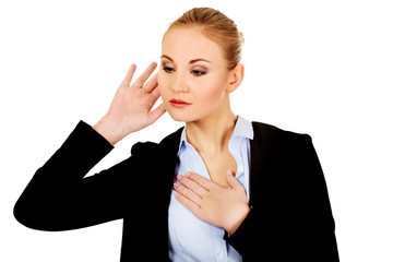 Young shocked business woman overhears a conversation