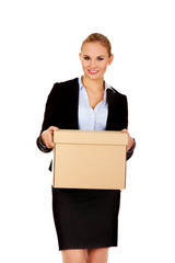 Business woman holding cardboard box