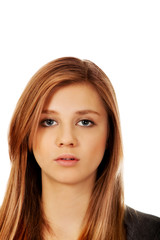 Fototapeta premium Portrait of teenage woman with serious face