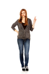 Funny teen woman putting hair like mustache