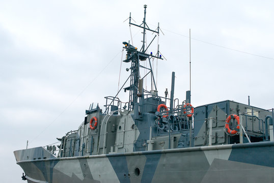 Naval ship with radar and gun.