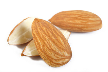 raw almond nuts isolated on white background