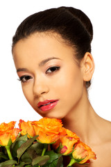 Fototapeta premium Beauty african woman with roses.