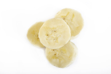 sliced bananas on white background