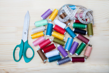 spools of thread, scissors and centimeter