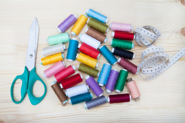 spools of thread, scissors and centimeter