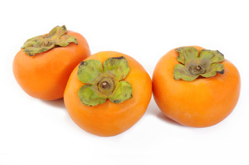 Fresh persimmon fruit isolated on white