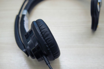 Close-up headphones ion the wooden table