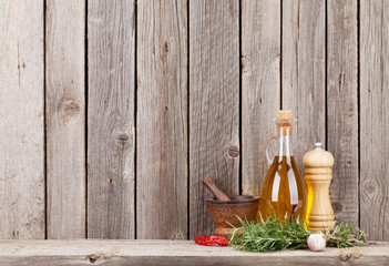 Kitchen utensils, herbs and spices on shelf