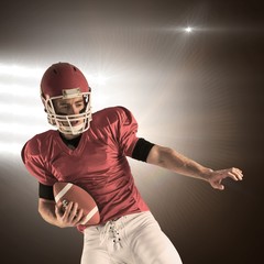 Composite image of american football player protecting football