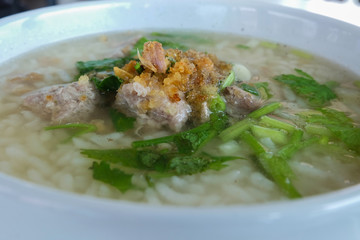 close up of Rice gruel, Thai chinese asian rice porridge with pork
