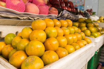 Naklejka na ściany i meble Orange for sale at market stall