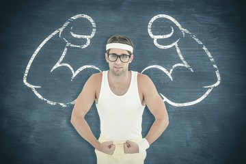 Composite image of geeky hipster posing in sportswear