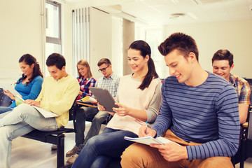 Fototapeta premium group of smiling students with tablet pc