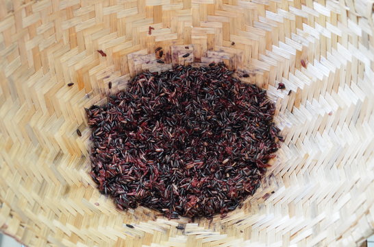 black sticky rice in bamboo earthenware steamer