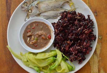black sticky rice eat with steam mackerel and shrimp paste sauce