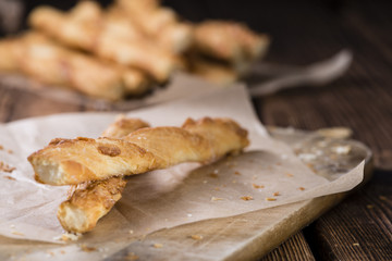 Crispy Pastry Sticks on wooden background