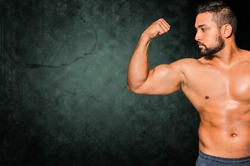 Obraz premium Composite image of bodybuilder man flexing his muscles