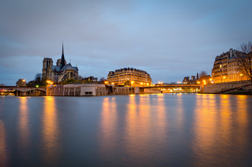 Notre Dame Cathedral and river Seine at twilight (Paris)