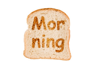 Word  morning written on a toasted slice of bread