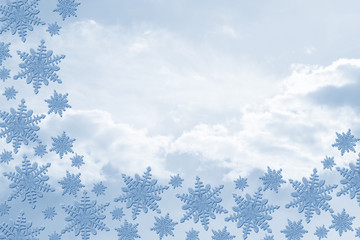 Blue Snowflakes with Clouds Background