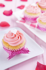 Pink Valentine cupcakes on a rustic pink table