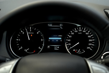 Modern car speedometer and illuminated dashboard