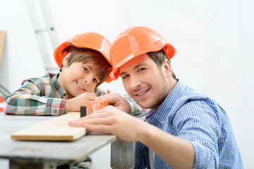 Father and son making renovation 