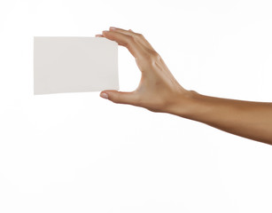 female hand holding a blank sheet of paper