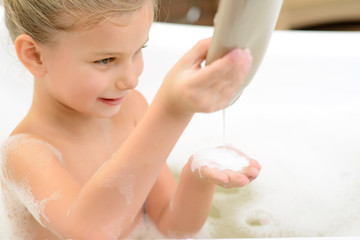 Pretty little girl taking bath 