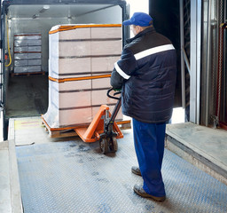 Fototapeta premium Worker loading on truck