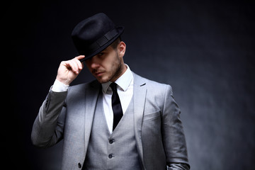 Portrait of handsome stylish man in elegant suit