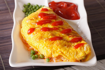  Japanese omelet stuffed with rice and chicken close-up. horizontal
