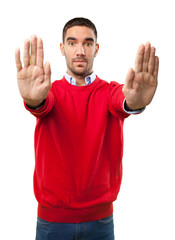 Fototapeta premium Young man stop gesture