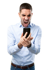 Angry man using a mobile phone