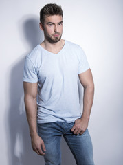 handsome young and fit man posing in casual clothes