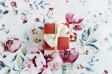 simple surprise little box with bow  on stylish flower paper, ho