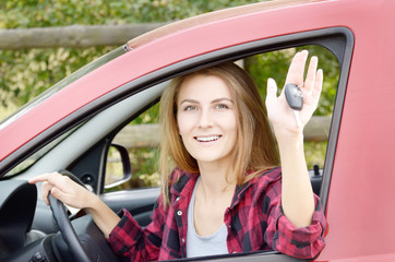 Naklejka premium Woman shows car key