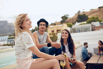 Group of young people having a rooftop party