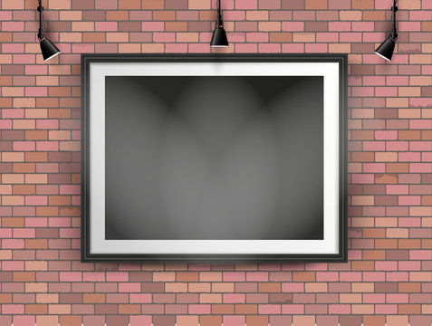 black photo frame on brick wall