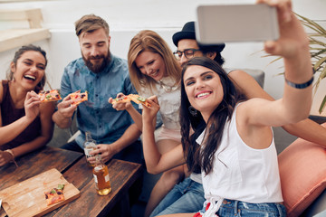 Taking a selfie during a pizza party