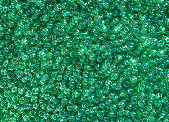 Shiny green seed beads background